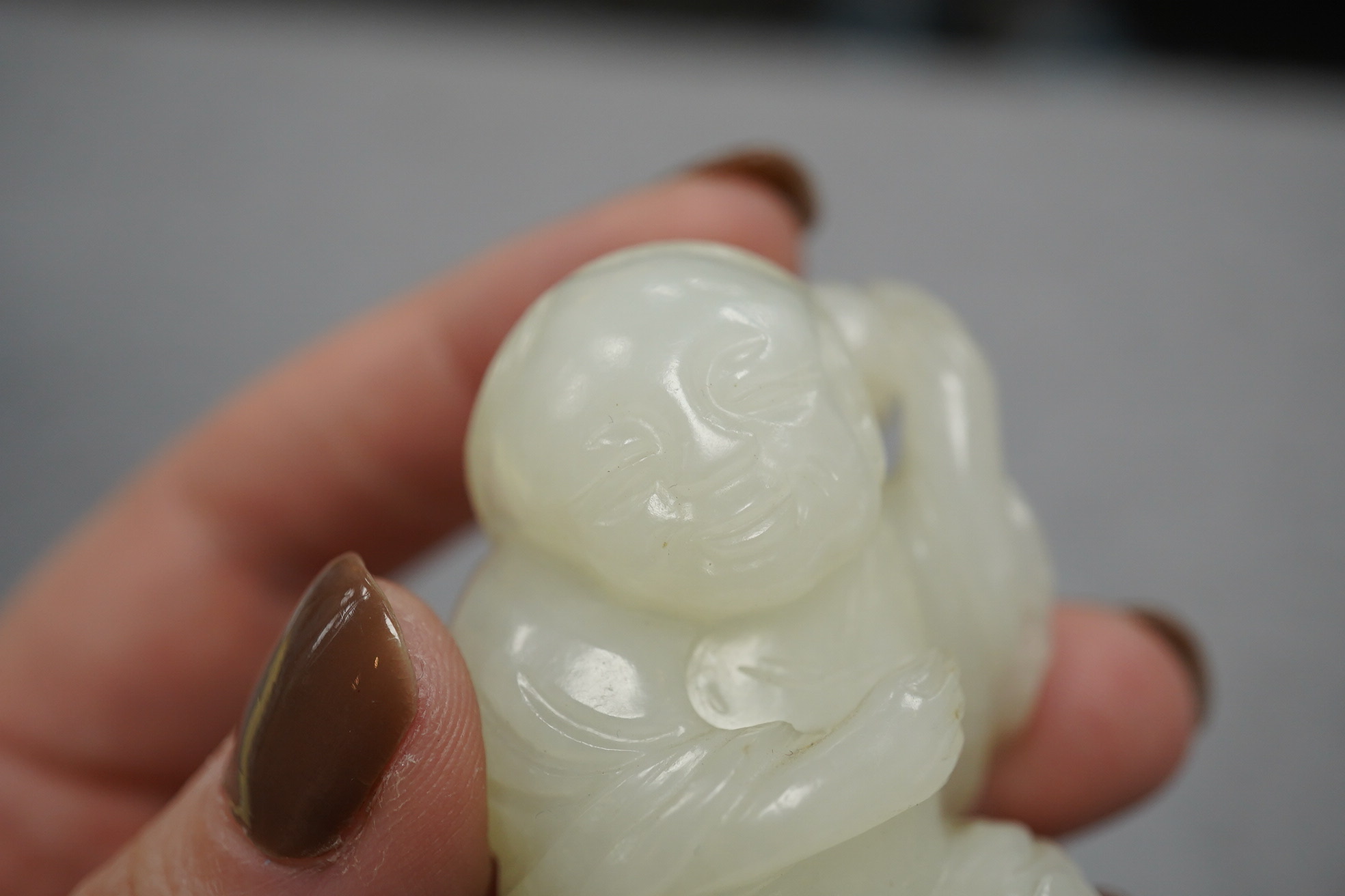 A Chinese white jade figure of Liu Hai, 18th-19th century